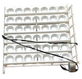 Motorized egg turner tray