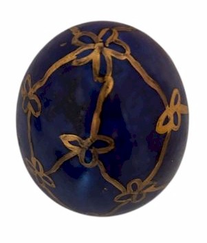 Decorative blue orb with gold swirls